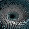 Huge Spiral is a dynamic and immersive abstract image that pulls the viewer into a seemingly endless vortex of motion and depth. Composed of tightly arranged geometric blocks, this massive spiral formation appears to rotate inward, drawing the eye toward the center of a mysterious void. The consistent rhythm and precision of the repeating forms give it a mechanical, almost turbine-like feel — evoking thoughts of gears, engines, or futuristic propulsion systems.