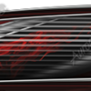 Vigilante is a bold, race-inspired partial wrap designed for speed, precision, and presence. Its dynamic layout features sharp horizontal streaks that slash across the design in a streamlined motion, giving the appearance of velocity and controlled aggression. Subtle abstract textures are embedded beneath layered linear elements, adding depth and complexity without overpowering the clean, mechanical flow of the graphic. The overall composition mimics motion blur, creating a sense of speed even when the vehicle is standing still.