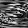 Swirl 1 is a bold and mesmerizing abstract design that captures the visual drama of liquid motion frozen in time. This piece features a tightly coiled vortex of smooth, reflective bands that twist and curve in endless loops, giving it an almost hypnotic quality. The polished texture creates a metallic, fluid effect, offering a sleek and modern look that can adapt to a range of design aesthetics.